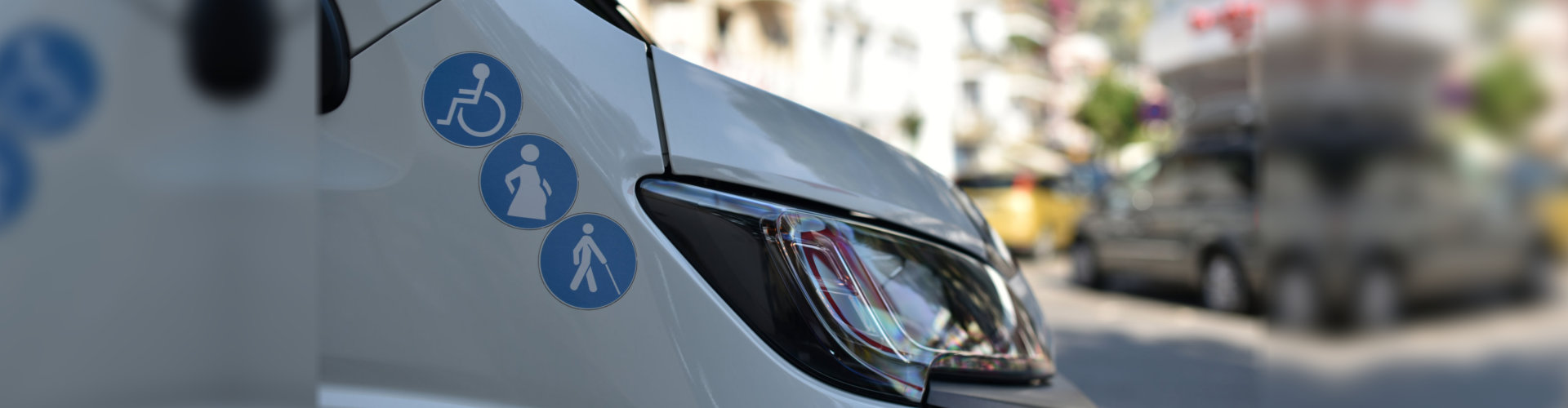 car with stickers for person with disabilities, pregnant women and elderly persons